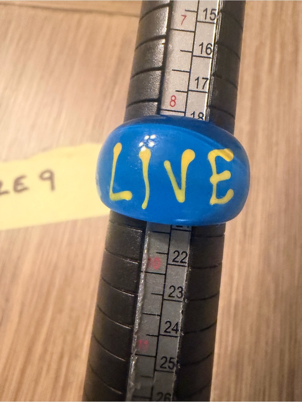 Blue with Yellow “LIVE' Text  Unbranded 
Statement Ring with Yellow Lettering
